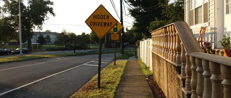 A street of houses with a sidewalk on Staten Island's east shore